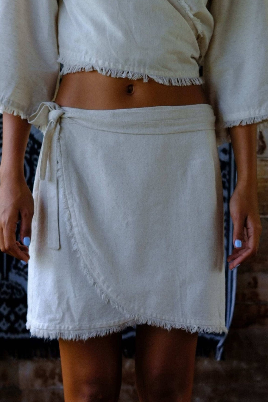 Linen Wrap Mini Skirt showcased with a relaxed crop top, embodying summer fashion, airy and stylish.