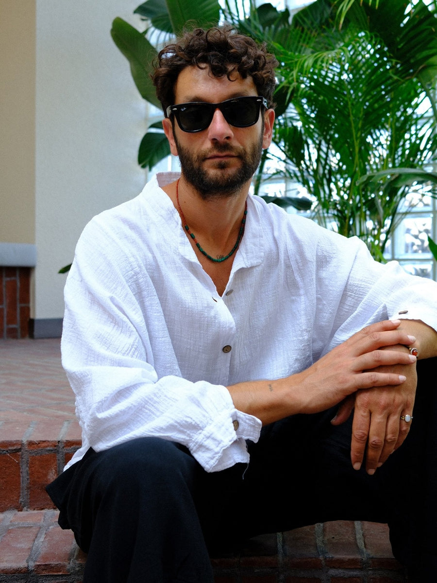 Morning portrait in white natural cotton at the cafe