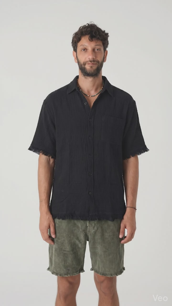 Model wearing a Black Gauze Short Sleeve Shirt, showcasing relaxed fit and raw-edge details, perfect for warm days.