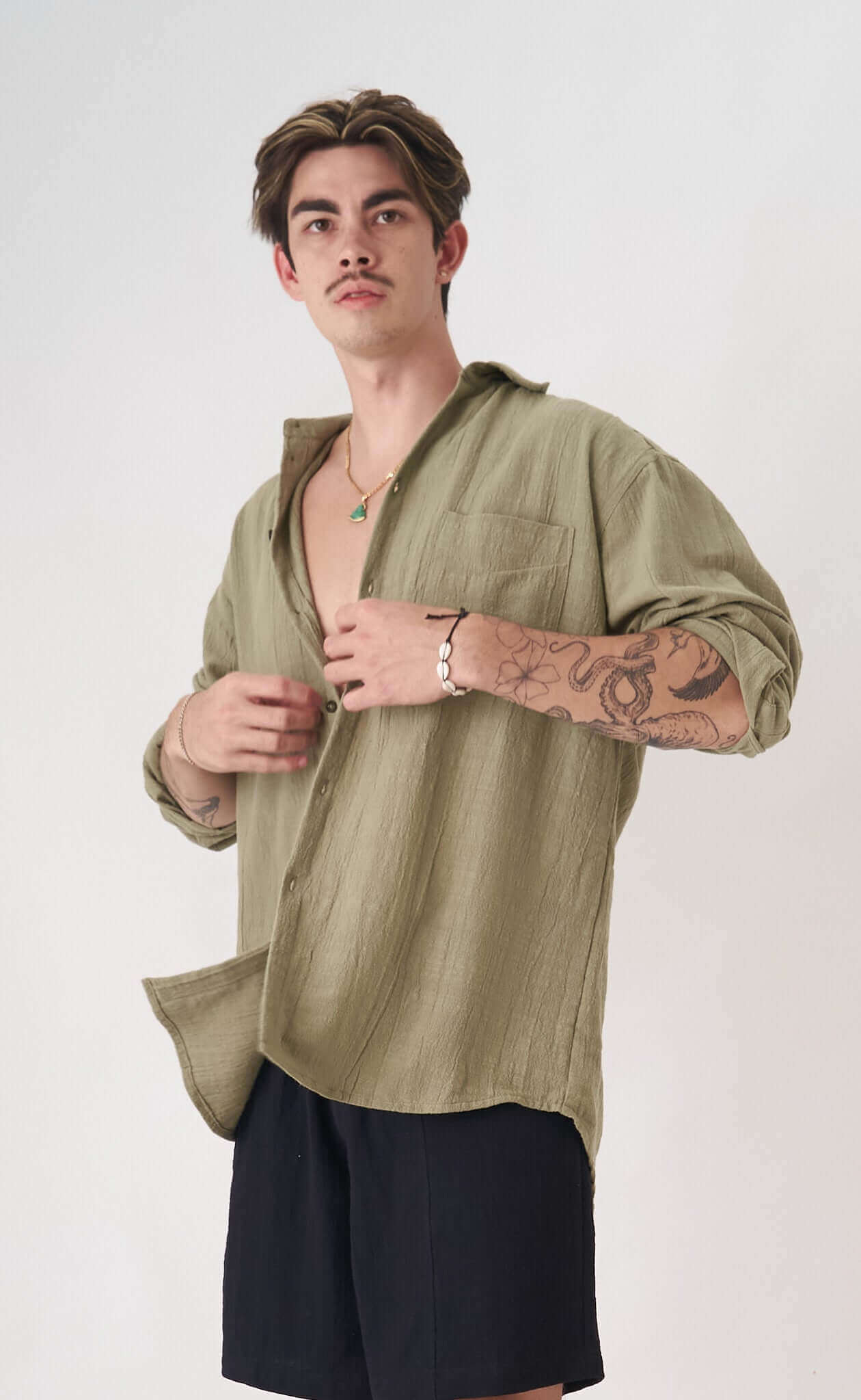 Sage Oversized Shirt shown on a model, perfect for summer and spring with a relaxed fit for casual and loungewear.